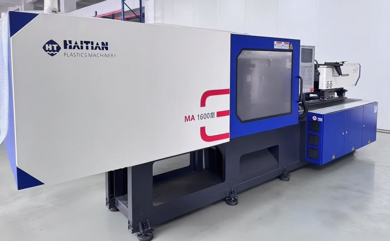 Turnkey injection molding cell reviewed for inline regrind and material return scope